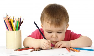 child drawing to develop fine motor skills
