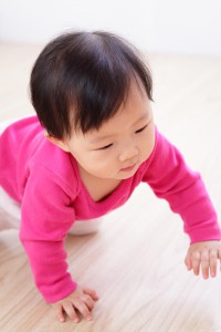 baby learning to crawl